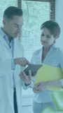 Animation of data processing over caucasian male doctor with nurse. Global medicine and digital interface concept digitally generated video. - Powered by Shutterstock - Get 15% off with code: PIKWIZARD15