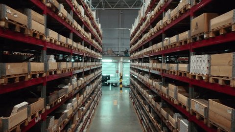 Drone Retreating along Warehouse Racks Stored Goods