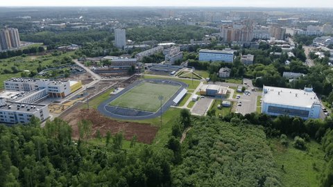 Drone Circling High above Stadium Forest Area
