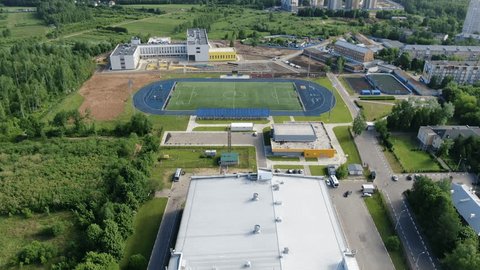 Aerial Forward Movement over Sports Field Campus
