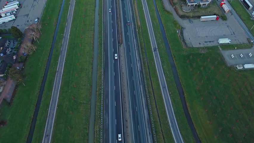 Suburban Highway Scene. Quiet Road With Parked Trailers. Light Illuminates Quiet Suburban Service Route. Peaceful Aerial View Of Suburban Highway With Trailers And Green Lawns