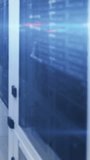 Vertical video: Glass rack cabinet left, feed driving mail, likes, hearts floating over rack for IT. Datacenter, hardware, dashboard, analytics, monitoring, overlays, vertical video - Powered by Shutterstock - Get 15% off with code: PIKWIZARD15