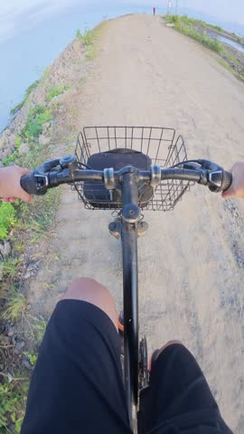 Riding a Bicycle on a Dirt Road