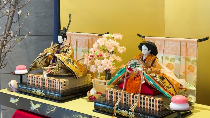 Static medium shot of ornate Hina-ningyo dolls displayed for Girls