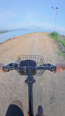 Riding Bicycle on a Dirt Road