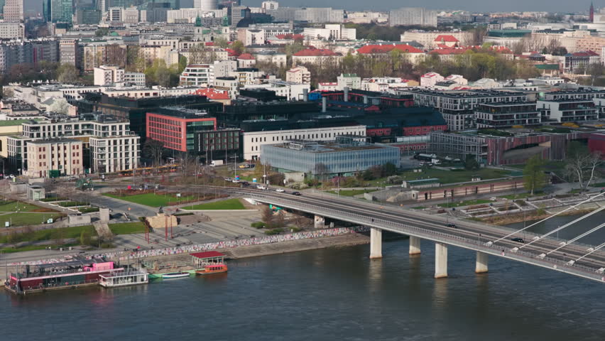 Centrum Nauki Kopernik, Warsaw, Poland - A Museum by the Vistula River, Surrounded by Modern Architecture and a Bridge, Offering a Stunning Urban View - Orbit Drone Shot