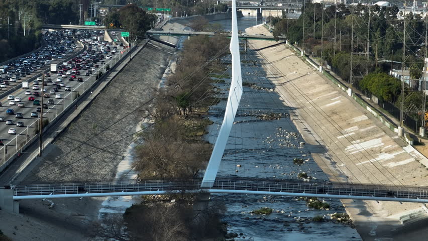 Drone rising in front of the North Atwater Bridge at Los Angeles River, sunny day