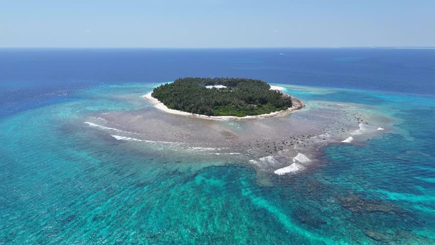 Small Tropical Island Maldives Surrounded by Clear Blue Ocean