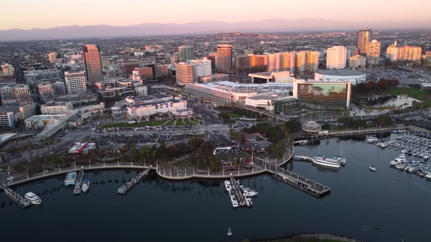 Long Beach, downtown waterfront skyline, Convention Center at sunset and Rainbow Harbor marina.