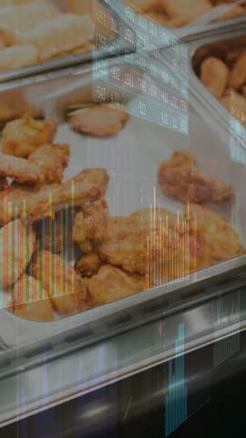 Vertical video: Metal tray with fried wings, charts appearing while camera shifting right for data. Buffet, restaurant, stainless, counter, graphics, overlay, vertical video
