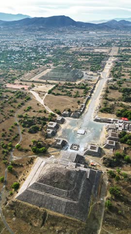 Aerial view of Teotihuacan archaeological site with moon pyramid and sun pyramid in Mexico landscape.