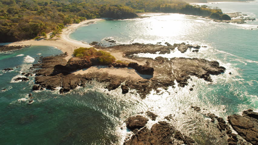 Aerial view flock of birds pelicans flies over Pacific Ocean in Costa Rica