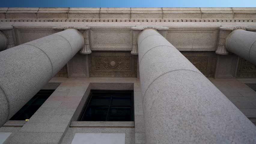 Columns of the Judicial building reflect the power of law and justice in Minnesotas Capitol in Saint Paul with each detail telling a story.