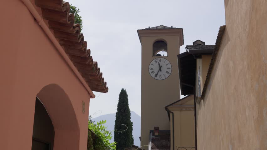 Historic clock church tower in the main square of Gravedona town Italy Italian Europe