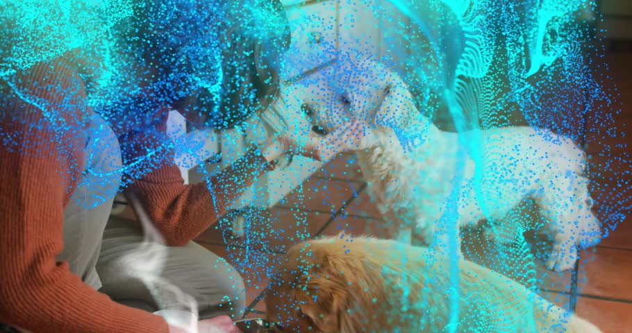 Woman kneeling in kitchen offering food and petting dogs as teal gold particles growing, pet care. Canines, companionship, affectionate, home, cozy, playful, interaction