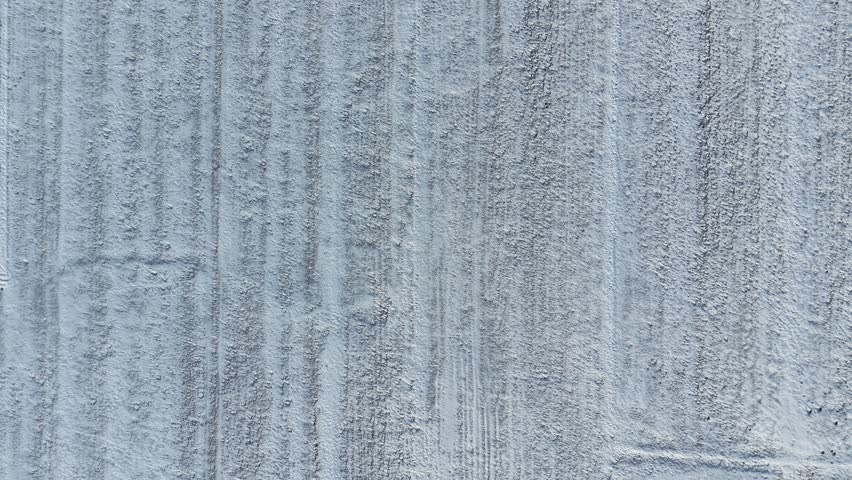 Winter farmland landscape with visible tractor driving lines