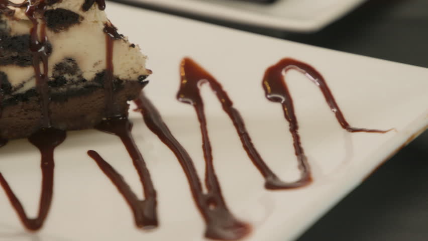 Close shot of a chocolate cake with a strawberry 