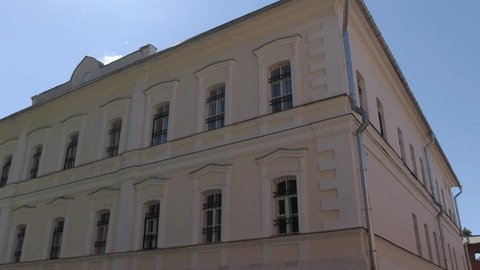 Drone Circling Building Facade near Historic Monastery