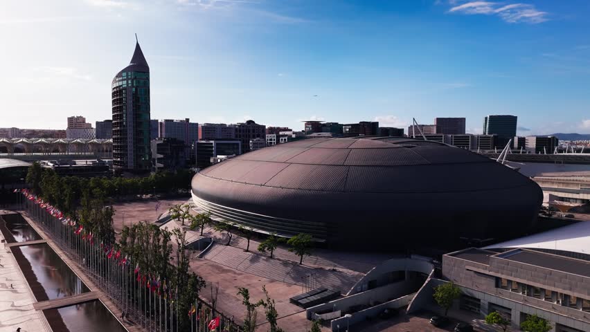 Aerial view of Altice Arena and Parque das Nacoes skyline on a cloudy day. Lisbon, Portugal