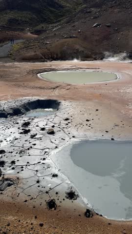 View of hot geothermal mud pots steaming at Krysuvik geothermal area, Reykjanes peninsula, Iceland