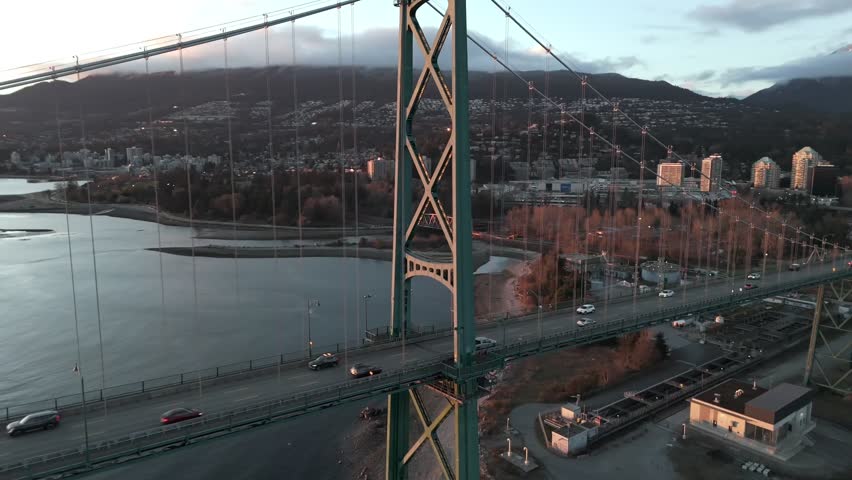 Traffic Crosses the Lions Gate Bridge in Vancouver, British Columbia, Canada - Orbit Drone Shot