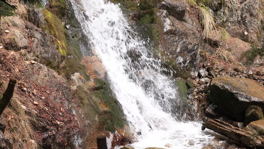 Mountain waterfall in early spring.