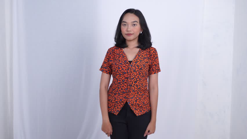 Happy Asian woman showing V sign and thumbs up gestures together, isolated white background