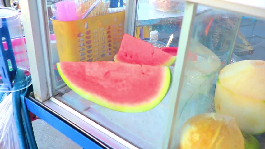 Small stall fruits fruits bar stand and street food with glass box in Khon Kaen District Khon Kaen Province Isan Northeast Thailand in Southeast Asia.