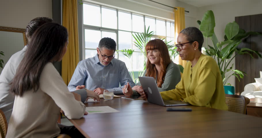 Diverse team engaged in a strategic business discussion