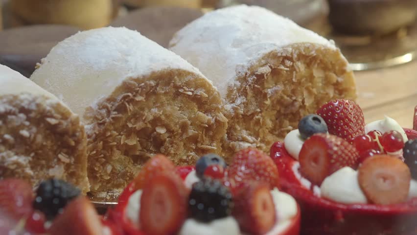 Variety of delicious pastries and cakes on display at a local bakery, perfect for dessert or a sweet treat.