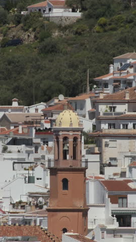 Church bell tower in Competa, Malaga, Spain. 4K Vertical