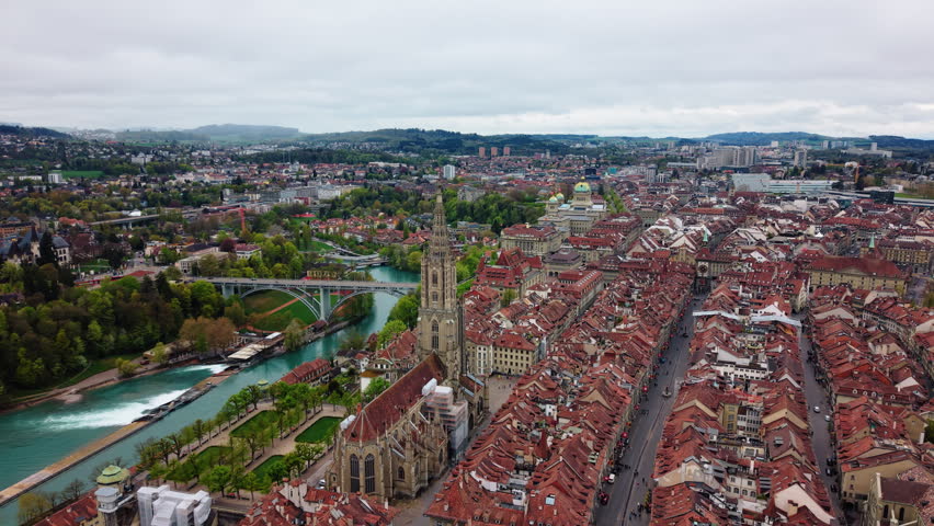 Aerial: Bern old town, Church of St. Peter and Paul and Federal Palace of Switzerland, parallax drone shot