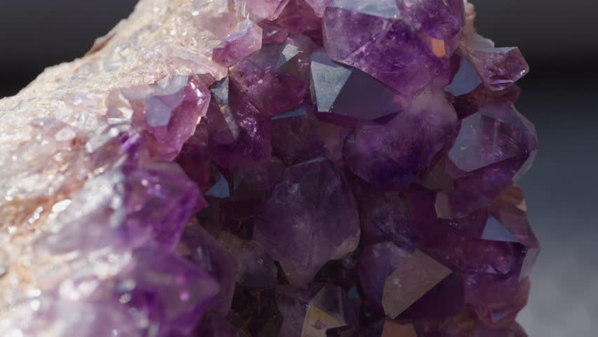 A macro of a purple amethyst druse