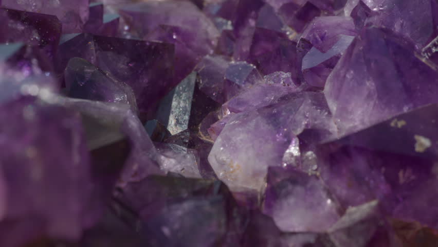 A macro of a purple amethyst druse