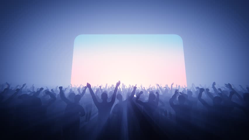 Energetic crowd at a concert with hands raised in the air, enjoying the music.