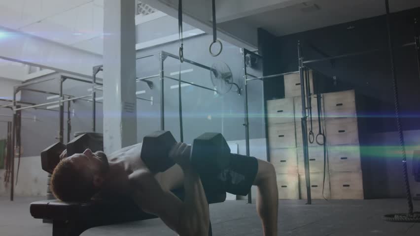 Man on bench initiating push with dumbbell, pressing for fitness, nodes highlighting chest sweeping. Athlete, gym, weights, reps, supine, overlay, lensflare