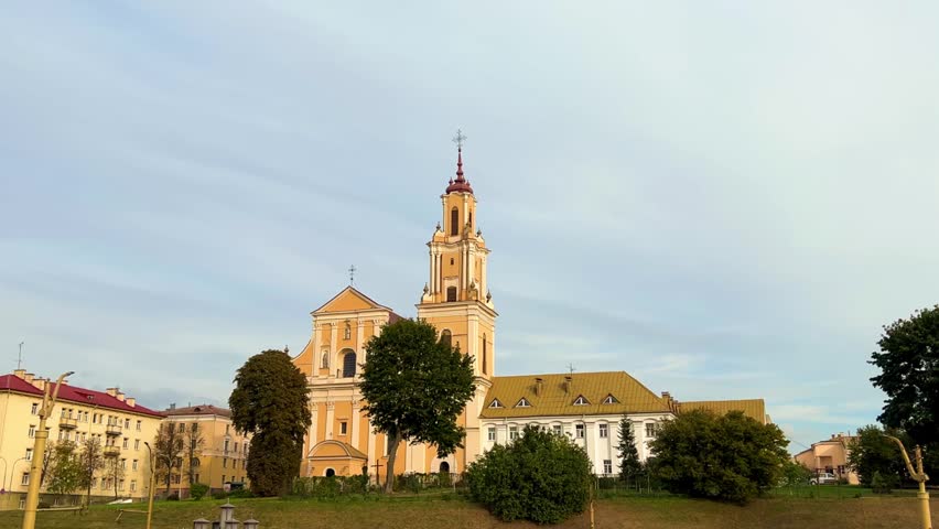 Grodno, Belarus - September 9, 2024: Fountain in front of the Bernardine Monastery. Church of the Finding of the Holy Cross. Architectural ensemble. 4К