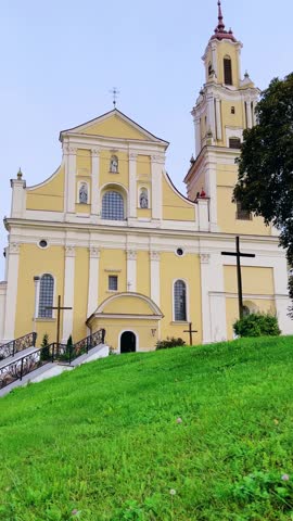 Grodno, Belarus - September 9, 2024: Fountain in front of the Bernardine Monastery. Church of the Finding of the Holy Cross. Architectural ensemble. 4К