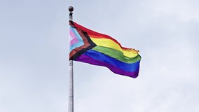 LGBT community. Tolerance and equality. World gay pride. Rainbow gay flag. Pride month. LGBTQ rainbow flag. LGBT rainbow flag waving against sky. Symbol of pride and LGBTQ. Colorful pride flag - Powered by Shutterstock - Get 15% off with code: PIKWIZARD15