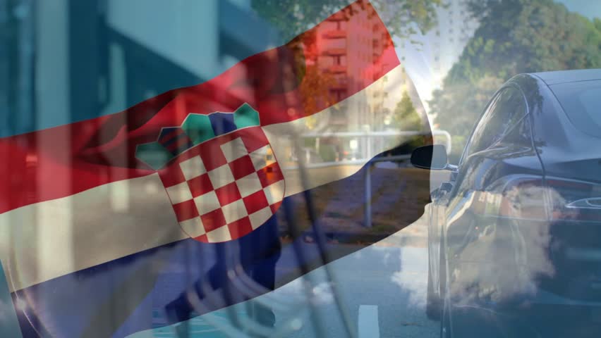 Flag overlay shifting and revealing man leaning into parked sedan, preparing to enter car for news. Urban, street, daylight, sunlit, sidewalk, storefront, railing