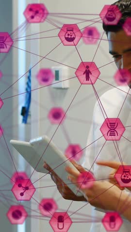Vertical video: Two medics tapping tablet to view clinical data, pink hex net overlaying hands. Colleagues, healthcare, device, touchscreen, collaboration, corridor, vertical video