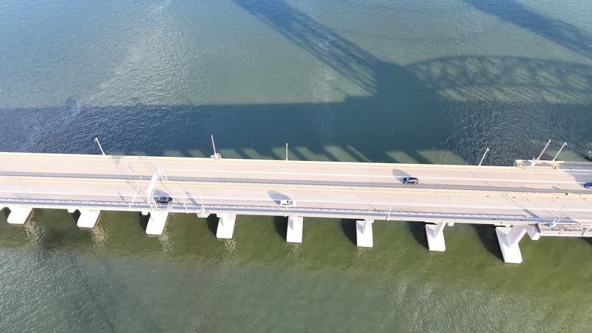 James River Lift Bridge JRB Over Calm Blue Water of James River With Tall Transmission Towers and Piers