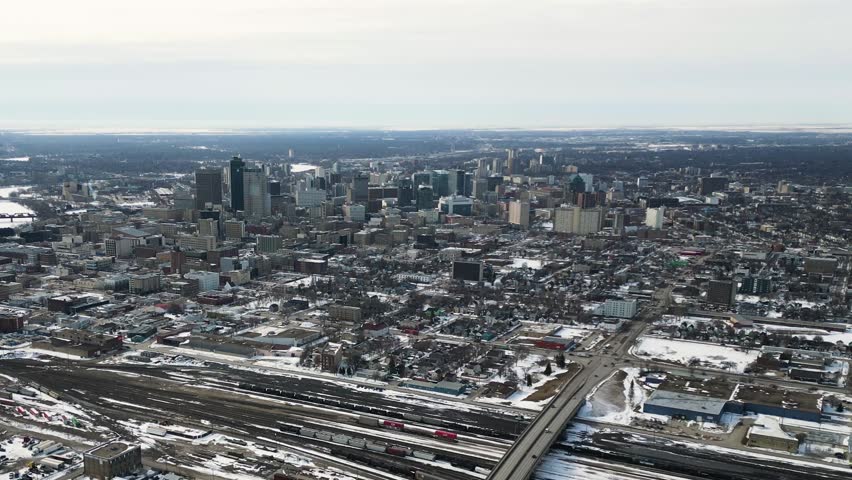 Telephoto drone shot of downtown Winnipeg Manitoba Canada in winter with snow on the ground