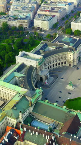 Vertical video. Vienna, Austria. Hofburg Palace (Neue Burg). Prince Eugen - The statue of the horseman. Flight over the city of Vienna. Aerial View, Point of interest. Rich colors