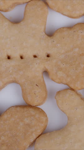 Golden shortbread bear pattern. Baked cookies with crumbly texture and features. Close up view showcasing textured shortbread cookies with detailed features and soft lighting