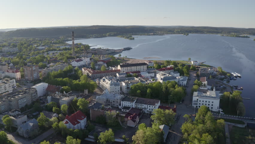 Backward reveal drone footage of Sortavala town on sunny summer morning. Karelia, Russia.