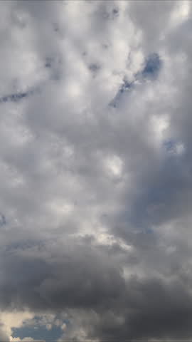 Dark storm brewing. Clouds gathering before rain. Dramatic time lapse of brewing storm clouds. Tense atmosphere with rolling thunder and threatening cloud cover overhead