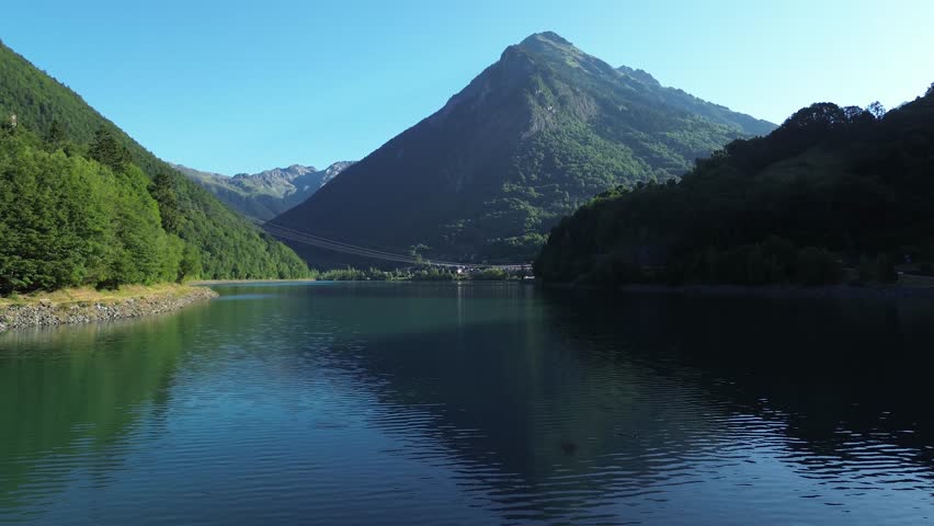 Aerial panoramic view of alpine lake and mountains in the French Alps - breathtaking scenery