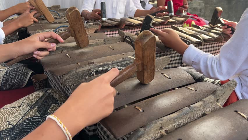 Traditional Balinese Gamelan Selonding Ensemble Played by Musicians at Hindu Temple Religious Ceremony in Bali, Indonesia