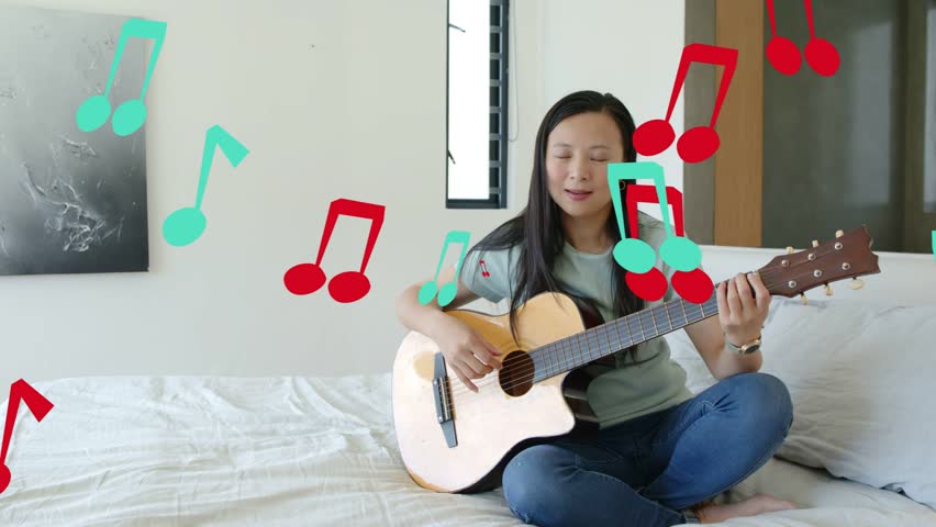 Woman musician starting guitar strumming practicing music red teal notes floating obscuring guitar. Instrument, acoustic, melody, bedroom, softlighting, minimalist, contemporary